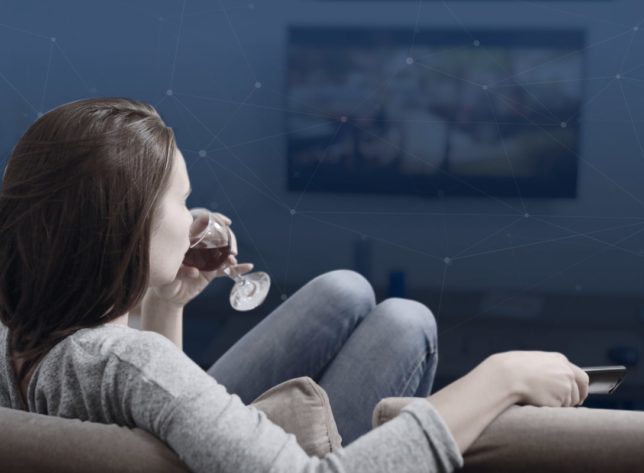 woman drinking wine watching programmatic ad